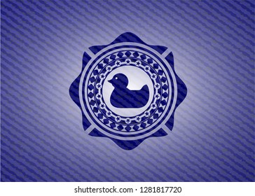 rubber duck icon inside jean background