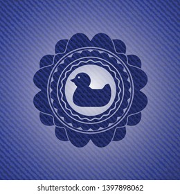 rubber duck icon inside jean background