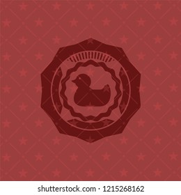 rubber duck icon inside realistic red emblem