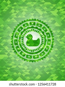 rubber duck icon inside realistic green mosaic emblem