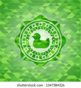 rubber duck icon inside realistic green emblem. Mosaic background