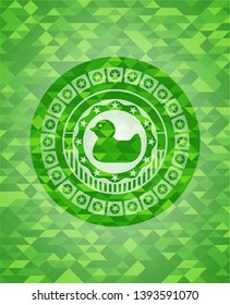 rubber duck icon inside realistic green emblem. Mosaic background