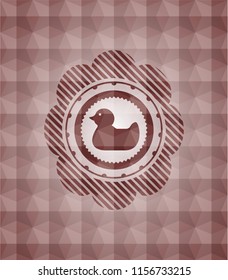 rubber duck icon inside red seamless geometric badge.