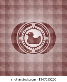 rubber duck icon inside red seamless badge with geometric pattern.