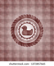 rubber duck icon inside red seamless emblem or badge with abstract geometric pattern background.