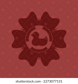 rubber duck icon inside red emblem. 