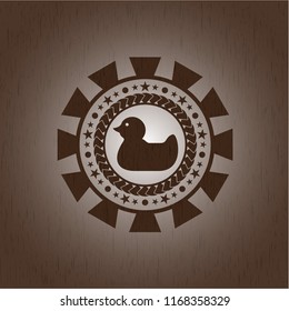 rubber duck icon inside retro wood emblem
