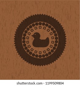 rubber duck icon inside retro style wooden emblem