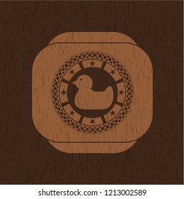 rubber duck icon inside retro wooden emblem