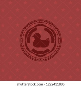 rubber duck icon inside retro red emblem
