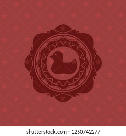 rubber duck icon inside retro style red emblem