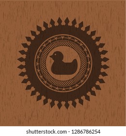 rubber duck icon inside retro wooden emblem