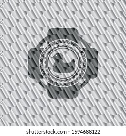 rubber duck icon inside silver shiny badge. Scales pattern. Vector Illustration. Detailed.