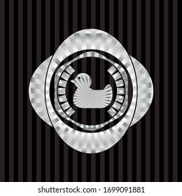 icono del pato de caucho dentro de una insignia brillante de plata