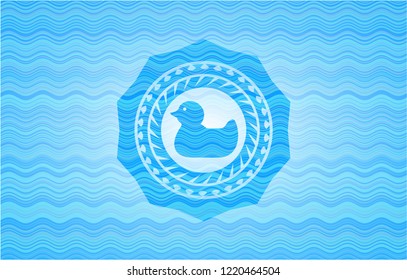 rubber duck icon inside sky blue water wave emblem.