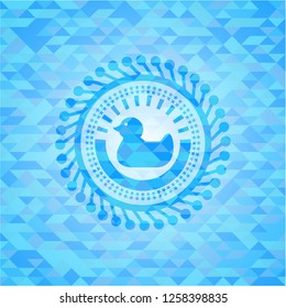 rubber duck icon inside sky blue emblem with triangle mosaic background