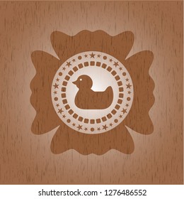 rubber duck icon inside vintage wood emblem