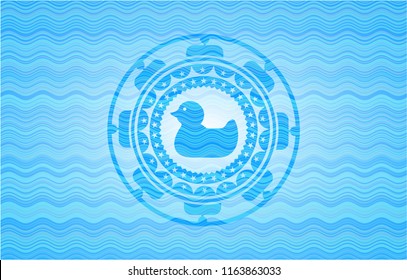 rubber duck icon inside water wave concept badge.