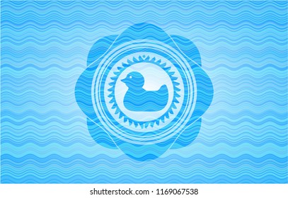 rubber duck icon inside water wave badge.