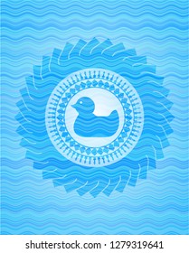 rubber duck icon inside water wave style emblem.