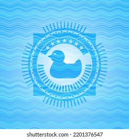 rubber duck icon inside water wave badge background. 