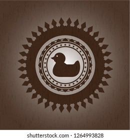 rubber duck icon inside wood badge or emblem