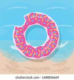 Rubber ring in the donut form on the beach.