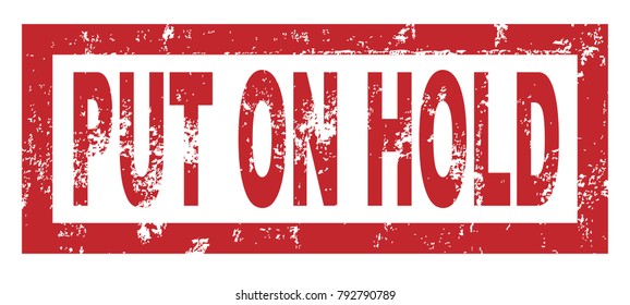 Rubber stamp with the text put on hold over a white background
