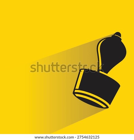rubber stamper icon with shadow on yellow background