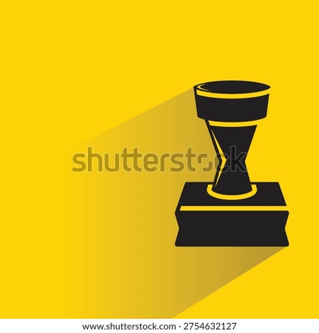 rubber stamper icon with shadow on yellow background