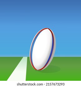 Rugby ball lying on the green lawn of a rugby field