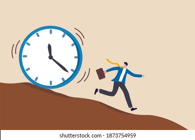 Run out of time, work deadline, time countdown or time management concept, tried businessman running away from falling rolling huge clock down hill.