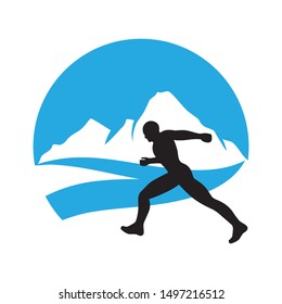 runner and blue mountain landscape in behind