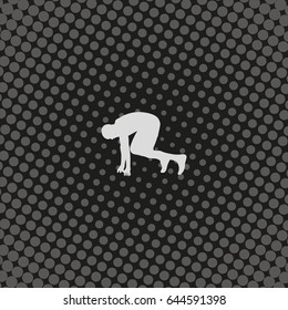Runner in start position silhouette.