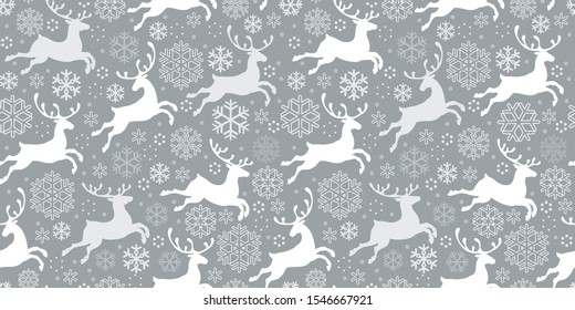 The Running Deers. Seamless pattern of white jumping deer isolated on grey background. Animals silhouettes and snowflakes. Winter background with reindeer. Vector. For Christmas, New Year design.