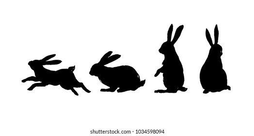 Running, sitting and standing rabbit. Black cut silhouette on a white background. Hand drawn design elements. Vector illustration.