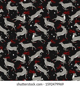 Running young deer with red horns. Seamless pattern with horned deers and snowfall. Black background.