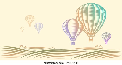 Rural landscape with field and hot air balloons in the sky