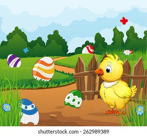 Rural landscape with a small chicken and painted easter eggs on a green meadow. Dense forest and sky in the background. Easter scene