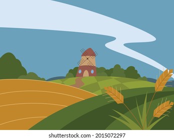 Paisaje rural con campo de trigo y molino
