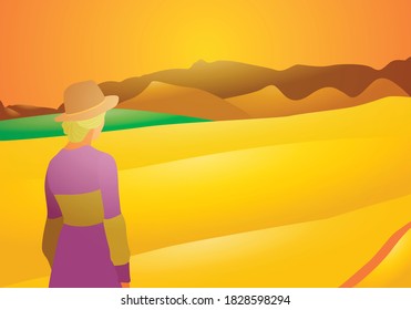 Rural woman observing farm fields at sunset.