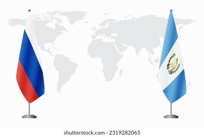 Russia and Guatemala flags for official meeting against background of world map.
