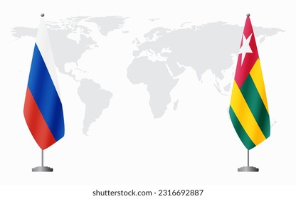 Russia and Togo flags for official meeting against background of world map.