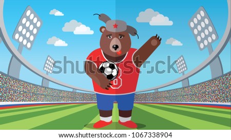 Russian bear with a soccer ball in the stadium