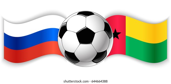 Russian and Bissau-Guinean wavy flags with football ball. Russia combined with Guinea-Bissau isolated on white. Football match or international sport competition concept.