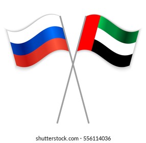 Russian and Emirian crossed flags. Russia combined with United Arab Emirates isolated on white. Language learning, international business or travel concept.