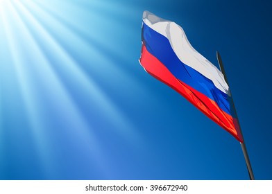 Russian flag on blue sky background with sunlight