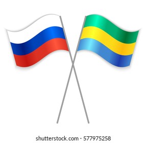 Russian and Gabonese crossed flags. Russia combined with Gabon isolated on white. Language learning, international business or travel concept.