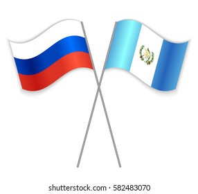 Russian and Guatemalan crossed flags. Russia combined with Guatemala isolated on white. Language learning, international business or travel concept.