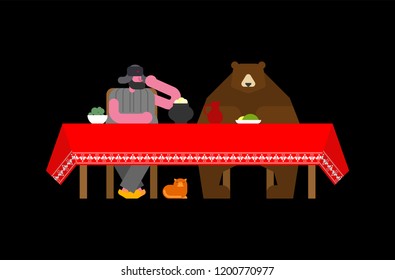 Russian man and bear at table. National folk beast from Russia
